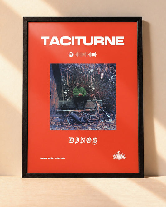 Poster Dinos – Taciturne encadré dans un cadre noir, posé contre un mur clair