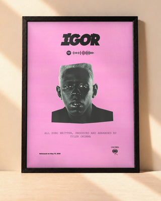 Poster Tyler, The Creator – IGOR encadré dans un cadre noir, posé contre un mur clair
